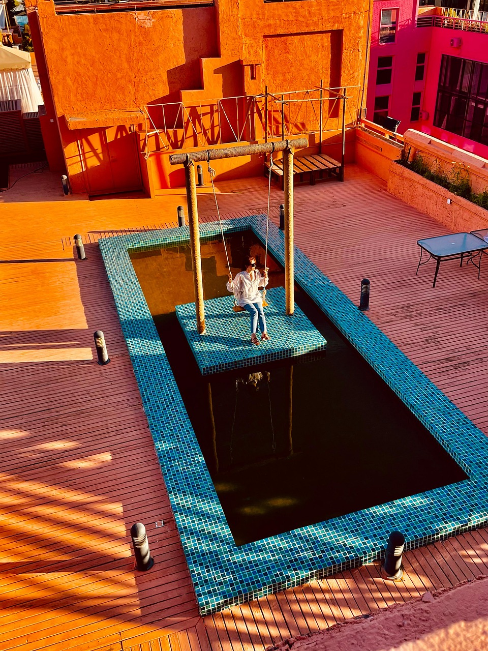 morocco, woman, swing, swimming pool, rooftop