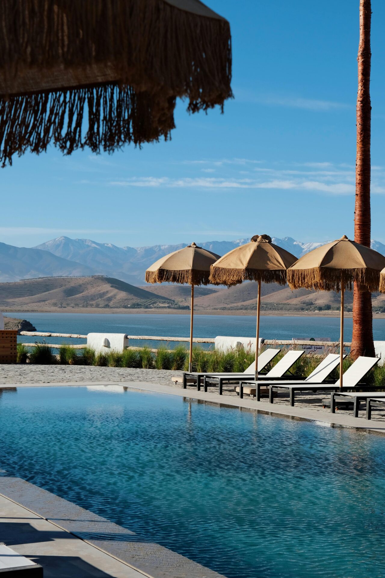 Tranquil poolside setting with mountain views in Aguergour, Morocco.